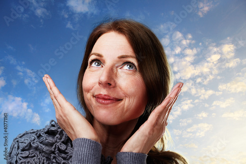 Photo: woman looking up into the sky woman looking up into the sky