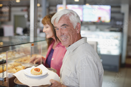 Foto: Older couple having lunch in cafe Older couple having lunch in cafe