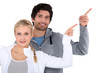 man and woman pointing with finger man and woman pointing with finger