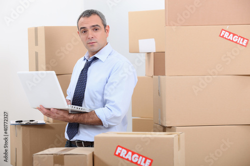 Photo: worker in warehouse worker in warehouse