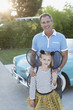 Father standing with daughter in fairy wings