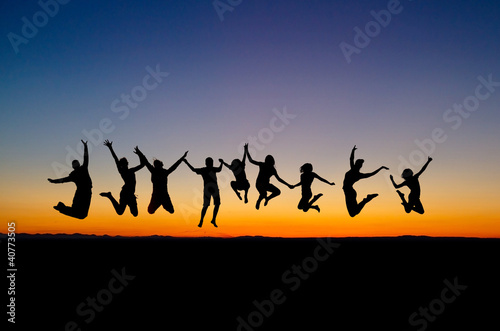 Photo: silhouette of friends jumping in sunset silhouette of friends jumping in sunset
