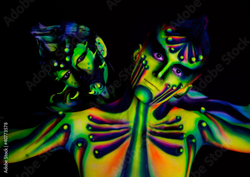Photo: Two men with fluorescent bodyart Two men with fluorescent bodyart
