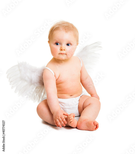 Photo: Cute infant angel with wings isolated on white Cute infant angel with wings isolated on white