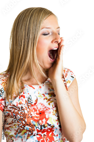 Photo: Yawning woman isolated on white Yawning woman isolated on white