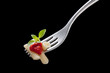 fork with macaroni and tomato