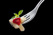 fork with macaroni and tomato