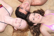 Friends lying on a beach Friends lying on a beach