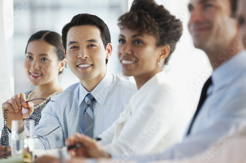 Photo: Business people sitting in meeting Business people sitting in meeting