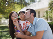 Family blowing bubbles together outdoors