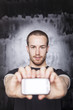 Man showing screen of smartphone, focus on guy Man showing screen of smartphone, focus on guy
