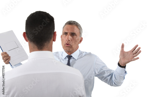 Photo: Man yelling at his assistant Man yelling at his assistant