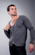 Fashionable muscular man in a fashion pose