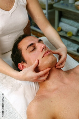 Photo: Man receiving face massage Man receiving face massage
