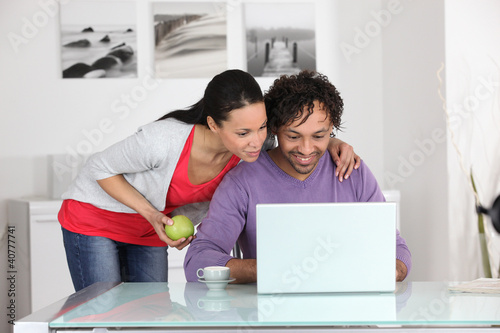 Photo: couple having fun on Internet couple having fun on Internet