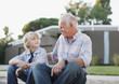 Older man and grandson sitting together