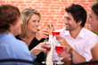 Photo: Four friends drinking in restaurant Four friends drinking in restaurant