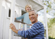 Older man and grandson playing outdoors