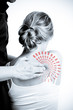 Massage therapist giving a massage. female receiving professiona Massage therapist giving a massage. female receiving professiona