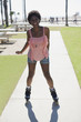 Smiling woman skating in park