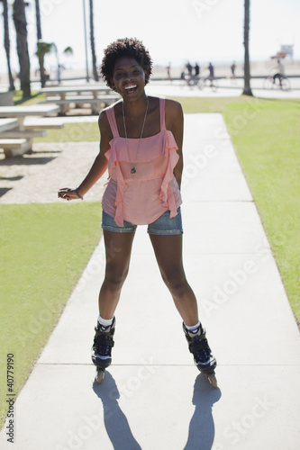 Photo: Smiling woman skating in park Smiling woman skating in park
