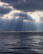 Foto: Light shining through clouds over water Light shining through clouds over water