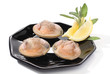 Three clams with lemon over white Three clams with lemon over white