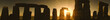 Sun rising over Stonehenge rock formation