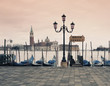 Gondolas docked in urban pier