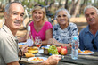 family eating picnic in the forest