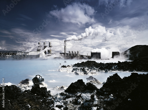 Photo: Factory build on rocky lake Factory build on rocky lake