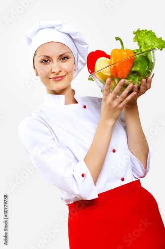 Photo: Portrait of a young cook in uniform Portrait of a young cook in uniform
