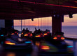 Time lapse view of bumper cars at sunset