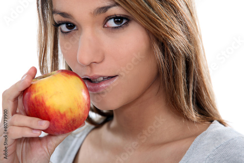 Photo: young sensual woman is going to eat an apple young sensual woman is going to eat an apple