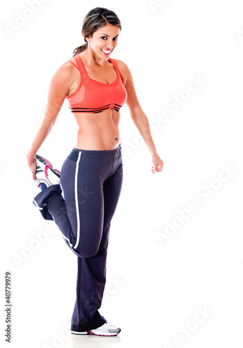 Photo: Athletic woman stretching Athletic woman stretching