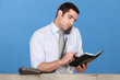 Man scheduling an appointment into his agenda