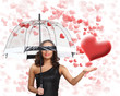 Photo: Pretty young woman with umbrella and hearts Pretty young woman with umbrella and hearts