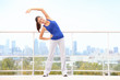 City workout woman stretching
