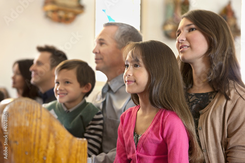 Photo: Family sitting together in church Family sitting together in church