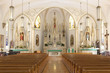 Pews and altar in empty ornate church
