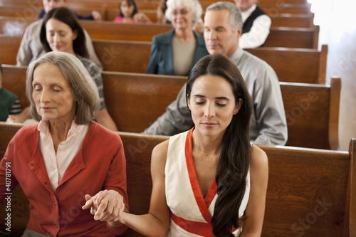 Photo: Congregation holding hands in prayer Congregation holding hands in prayer