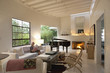 Woman reading in modern living room