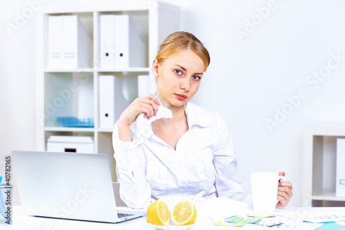 Photo: People with cold and flu at work place People with cold and flu at work place