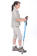 Studio shot of a female walker with poles