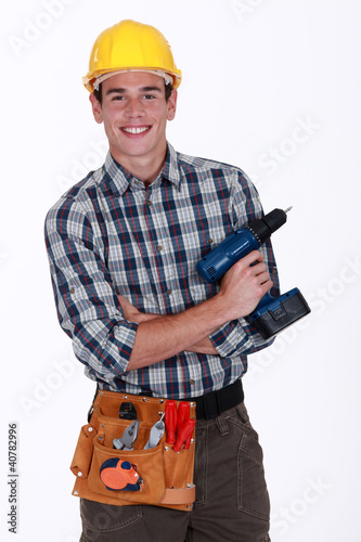 Photo: Man with a cordless screwdriver Man with a cordless screwdriver