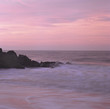 Waves washing up on rocky beach