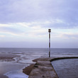 Foto: Waves washing up on stone pier Waves washing up on stone pier