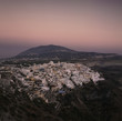 Urban city on rural hillside