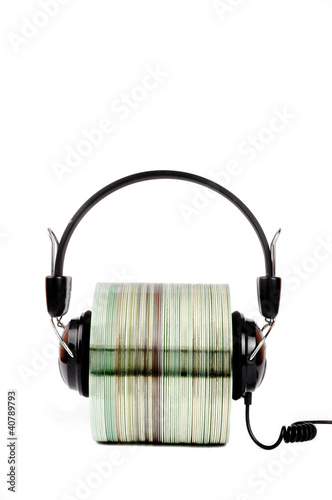 Foto: cd with headphones clamped cd with headphones clamped