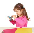Little Child Girl Making a Cutout